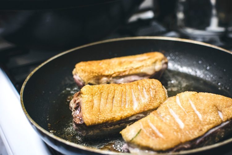 Frying medium duck breast in a pan
